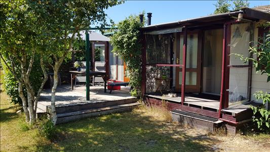 Vanaf € 320,-. Texel - Luxe Chalet (2 volwassenen, 2 kinderen) op schitterende locatie vlak bij bos en strand - "Ta Lème"